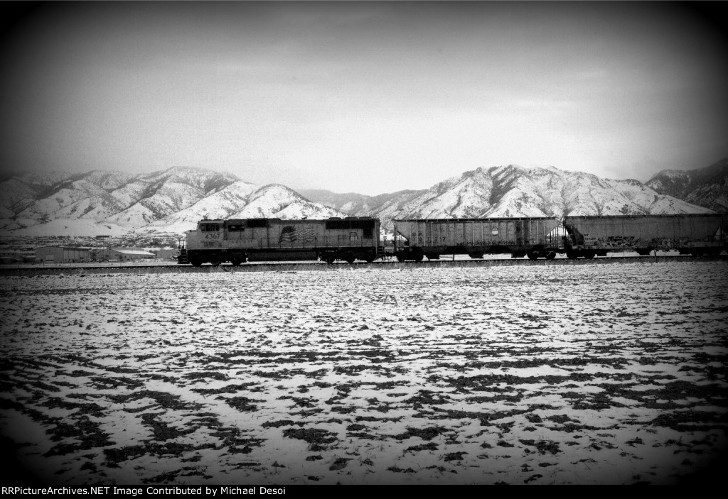 UP SD70M #4367 leads the northbound Cache Valley Local (LCG-41C) approaching the Airport Rd. Xing in Logan, Utah. April 13, 2022